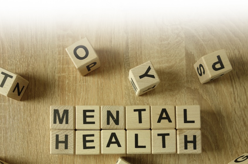 A decorative image depicting wooden cubes spelling out the word, mental health