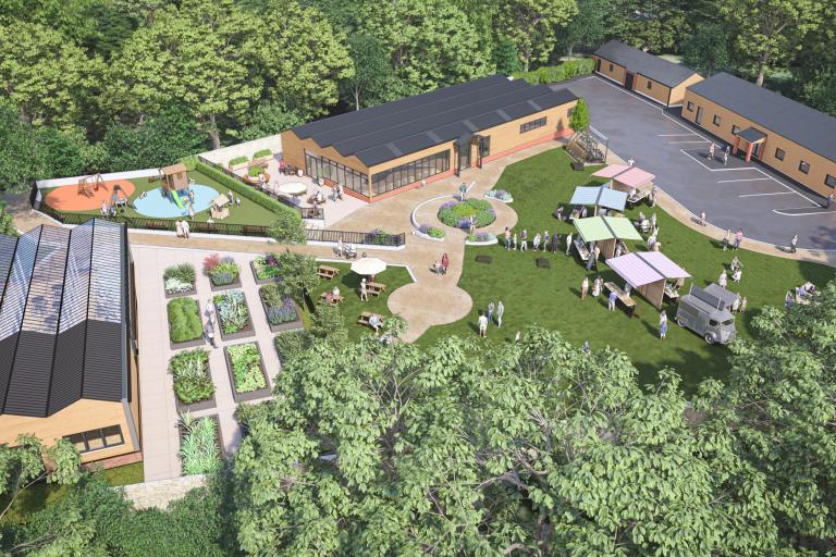 Artist impression of an aerial view of how the new West House walled garden and café will look. There are light coloured brick buildings with dark or glass roofs on three sides of the site, with paved areas between garden beds filled with plants in the centre.