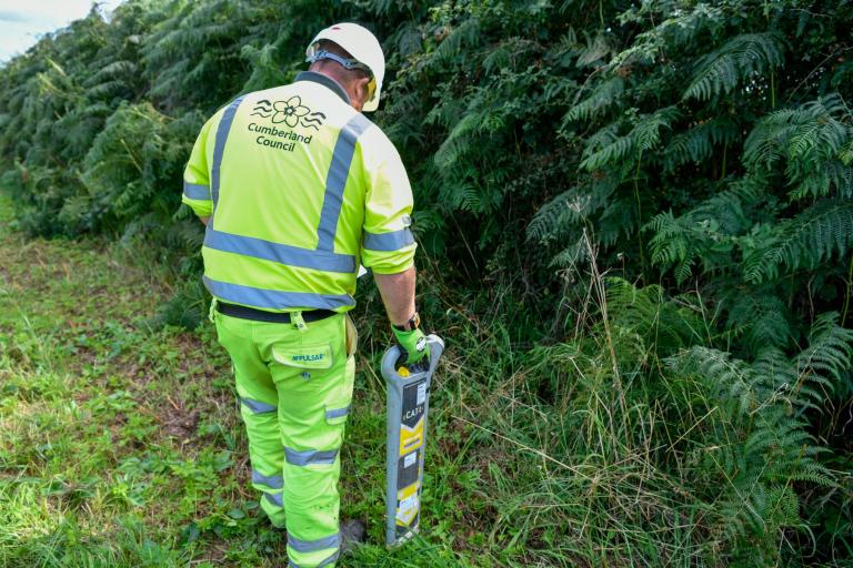 Highways staff member checking for electricity