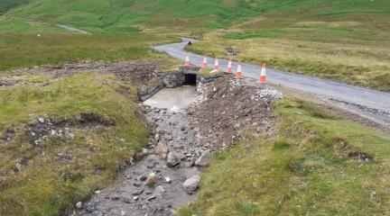 Culvert with traffic cones on Honister Pass