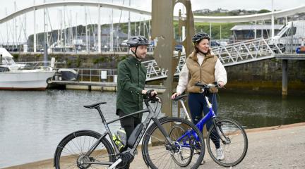 Two people cycling in Whitehaven