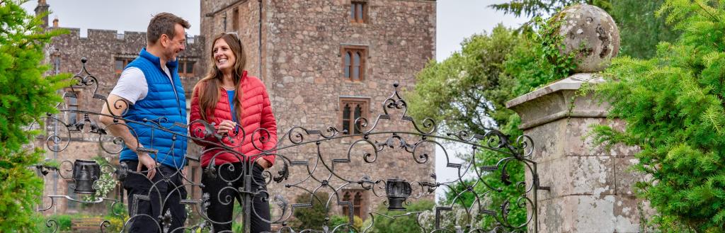 A couple outside Muncaster Castle