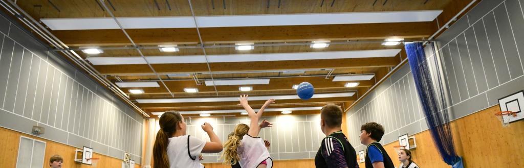 Group of young people playing basketball