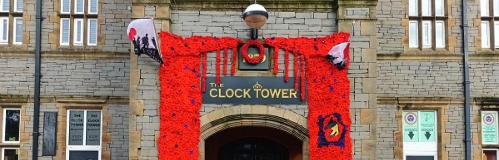 The Clock Tower door decorated with poppies