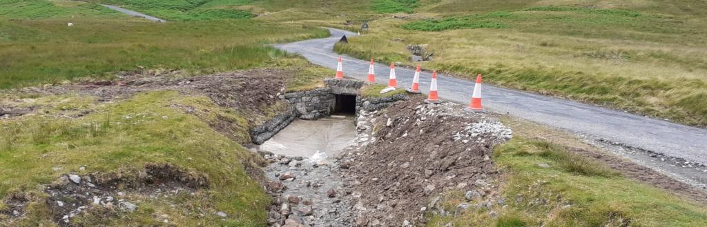 Culvert with traffic cones on Honister Pass