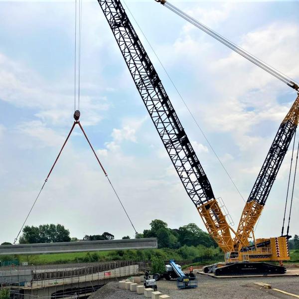 The new West Coast Main Line Bridge beams being lifted into place